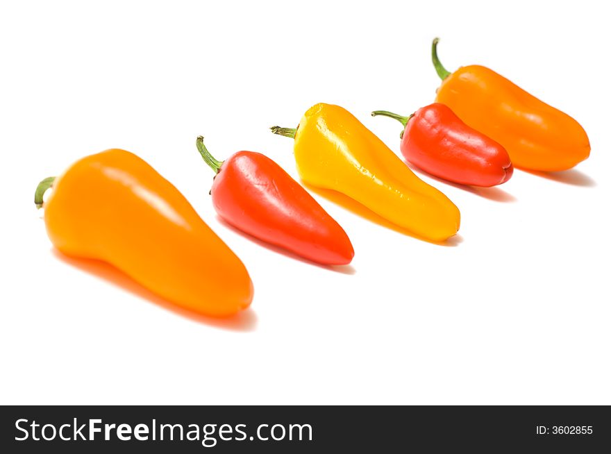 Fresh sweet peppers on white background, with copy space