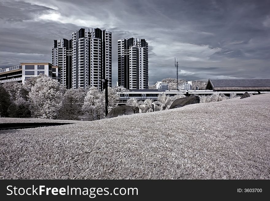 Infrared photo- field and modern building in the parks. Infrared photo- field and modern building in the parks