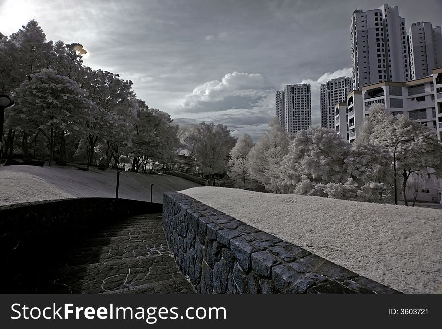 Infrared photo- walk path and modern building in the parks. Infrared photo- walk path and modern building in the parks