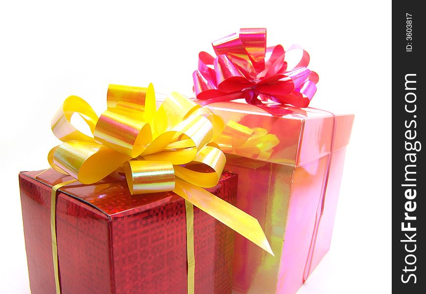 Gifts in red and pink boxes on a white background