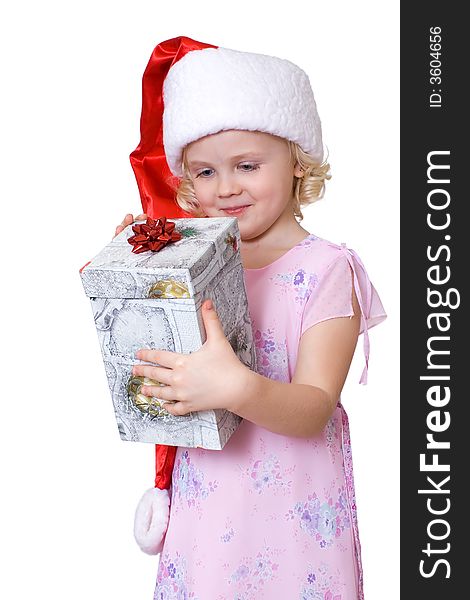 Cute fair-haired girl in Santa's hat with present  box. Cute fair-haired girl in Santa's hat with present  box