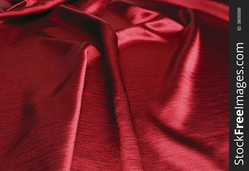 Soft,reflective red satin background. Soft,reflective red satin background