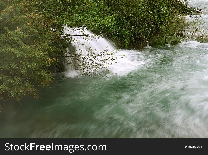 Waterfall with moving water and trees