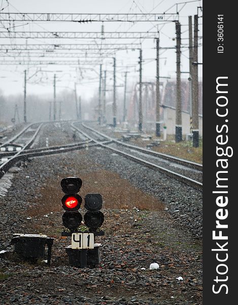 Railroad with a red light signal