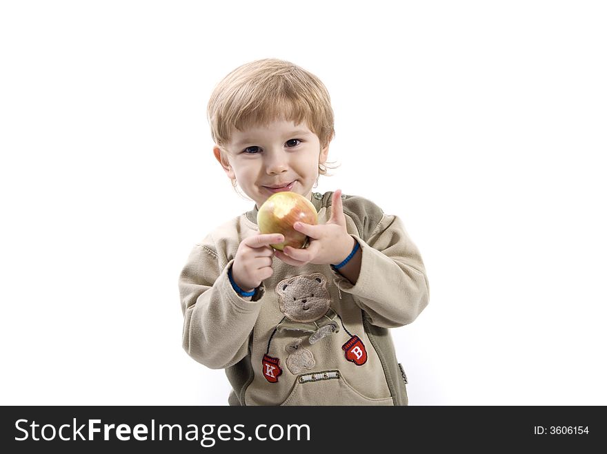 Young girl is smiling and holding apple