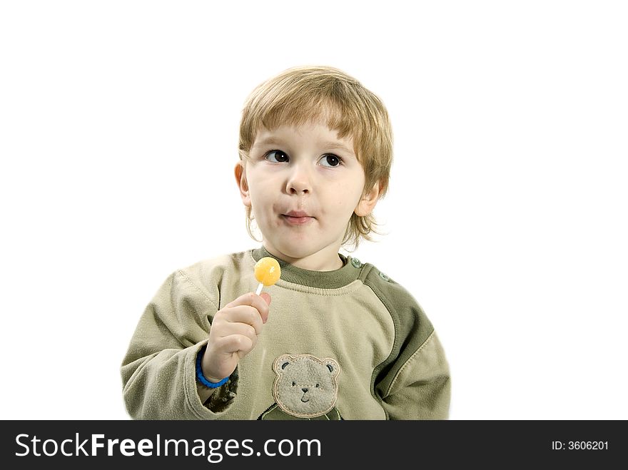 Young girl eating a candy