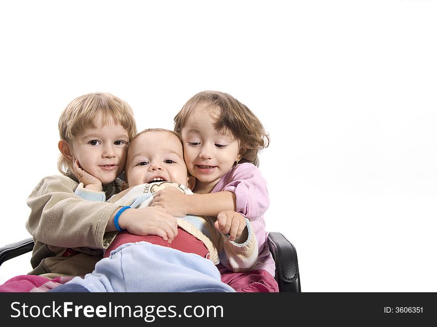 Three kids smiling and holding each other. Three kids smiling and holding each other