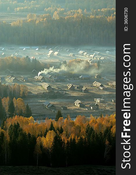 Smoke from kitchen chimneys in morningã€‚
Late autumn.
In Xinjiang,China.
villages.