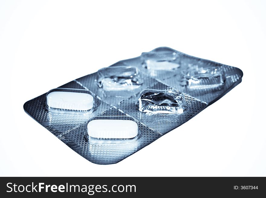 Image of used medicine tablet blister pack isolated against white background. Image of used medicine tablet blister pack isolated against white background.