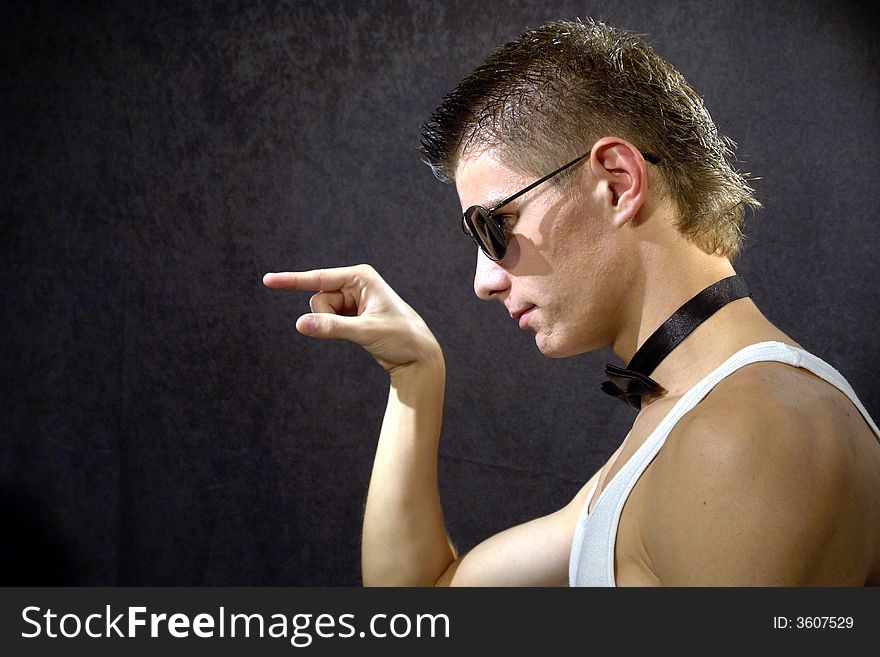 Great looking guy shot in studio - pointing right. Great looking guy shot in studio - pointing right