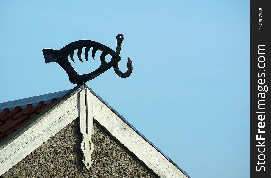 Fish shaped weather-vane in fishermen village Nida at Lithuania