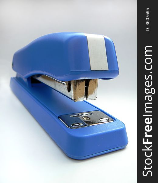 Blue stapler on white background