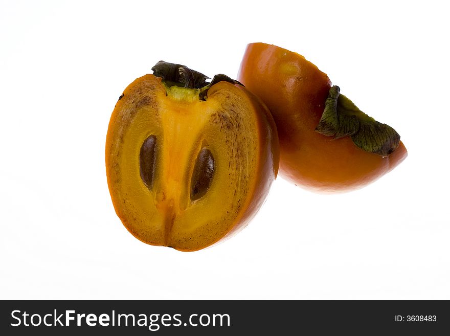 Isolated Fruit persimmon cutted half to half