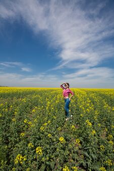 Young Beautiful Woman In Flowering Field In Summer. Outdoors Stock Photo Young Beautiful Woman In Flowering Field In Summer. Outdoors Stock Photo