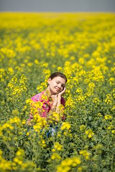 Young Beautiful Woman In Flowering Field In Summer. Outdoors Stock Images Young Beautiful Woman In Flowering Field In Summer. Outdoors Stock Images