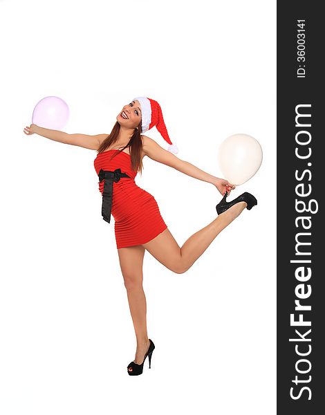 Beautiful young girl with red dress and santa claus hat holding balloons. Beautiful young girl with red dress and santa claus hat holding balloons