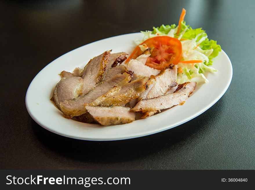 Roasted pork on the table in the restaurant.