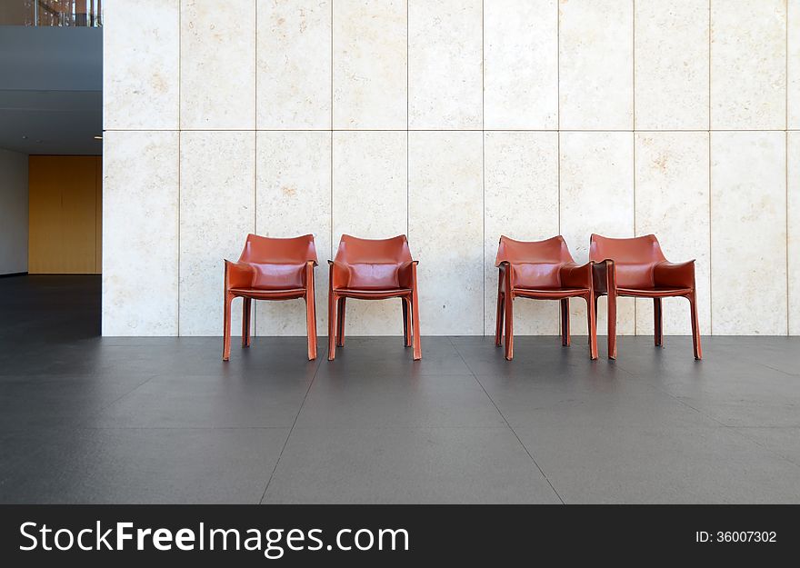 Beautiful interior with modern leather chair on stone floor