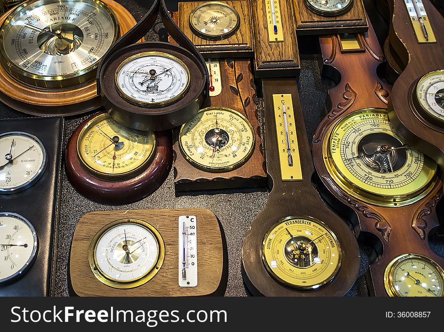 Various vintage barometers and thermometers exposed together. Various vintage barometers and thermometers exposed together