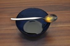 Honey Cup And Spoon Royalty Free Stock Photography