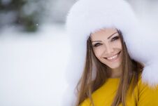 Winter Portrait Of Beautiful Smiling Woman With Snowflakes In White Furs Stock Photography