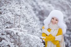 Winter Portrait Of Beautiful Smiling Woman With Snowflakes In White Furs Royalty Free Stock Image