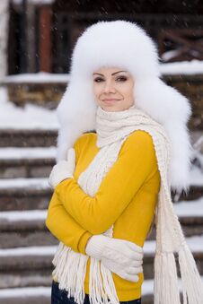 Winter Portrait Of Beautiful Smiling Woman With Snowflakes In White Furs Royalty Free Stock Photography