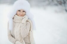 Winter Portrait Of Beautiful Smiling Woman With Snowflakes In White Furs Royalty Free Stock Image