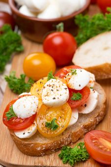 Ciabatta With Mozzarella And Colorful Cherry Tomatoes, Close-up Royalty Free Stock Image Ciabatta With Mozzarella And Colorful Cherry Tomatoes, Close-up Royalty Free Stock Image