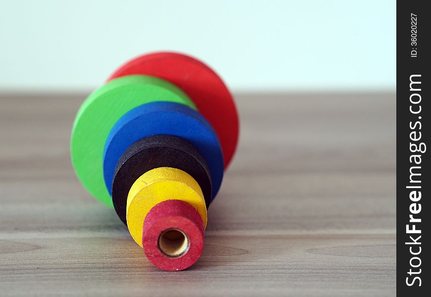 Toy mounting made ​​of colored wooden circles. Toy mounting made ​​of colored wooden circles