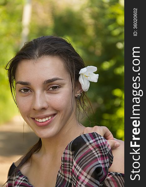 Young girl in the tropical country with white flower. Young girl in the tropical country with white flower