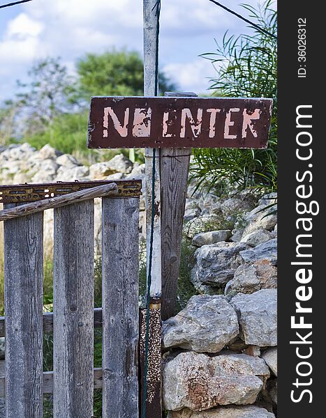 A NO ENTER sign located near a private property in the countryside on the island of Malta. A NO ENTER sign located near a private property in the countryside on the island of Malta