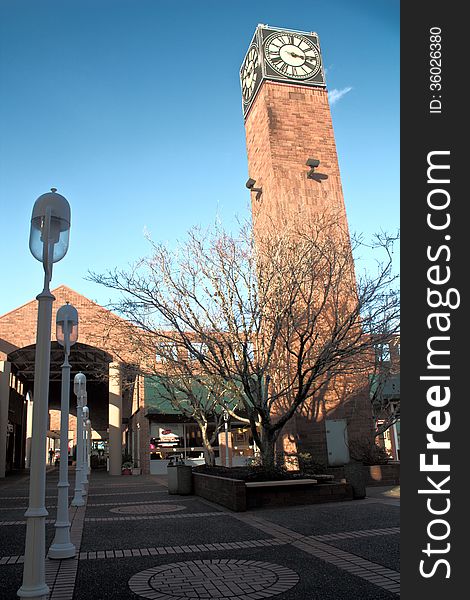 Beautiful clock tower in the center of a shopping area. Beautiful clock tower in the center of a shopping area.