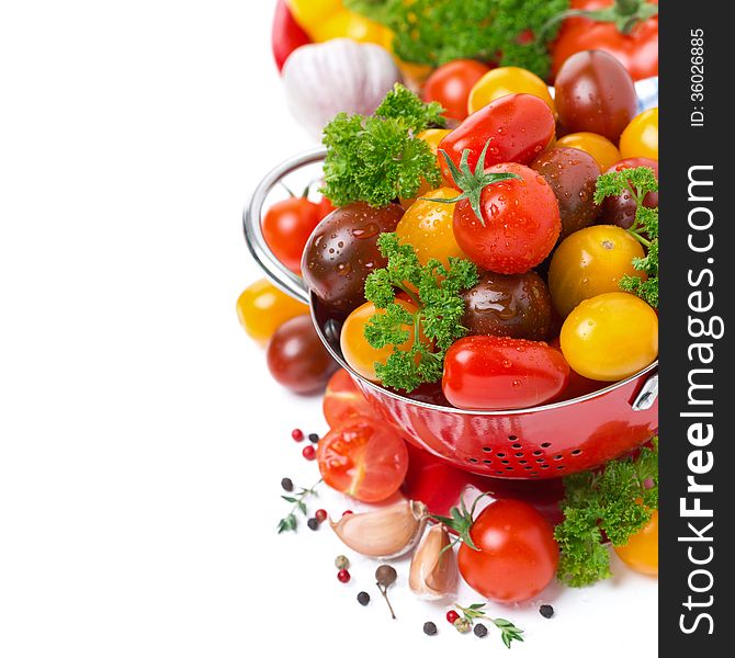 Assorted Cherry Tomatoes In A Colander, Spices And Fresh Herbs