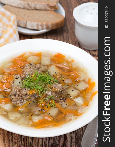 Vegetable soup with meatballs, close-up