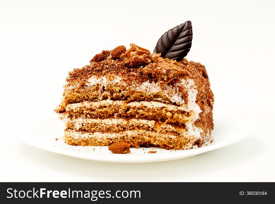 Piece of delicious chocolate cake isolated