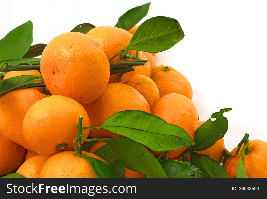 Tangerines with leaves in the lower left corner