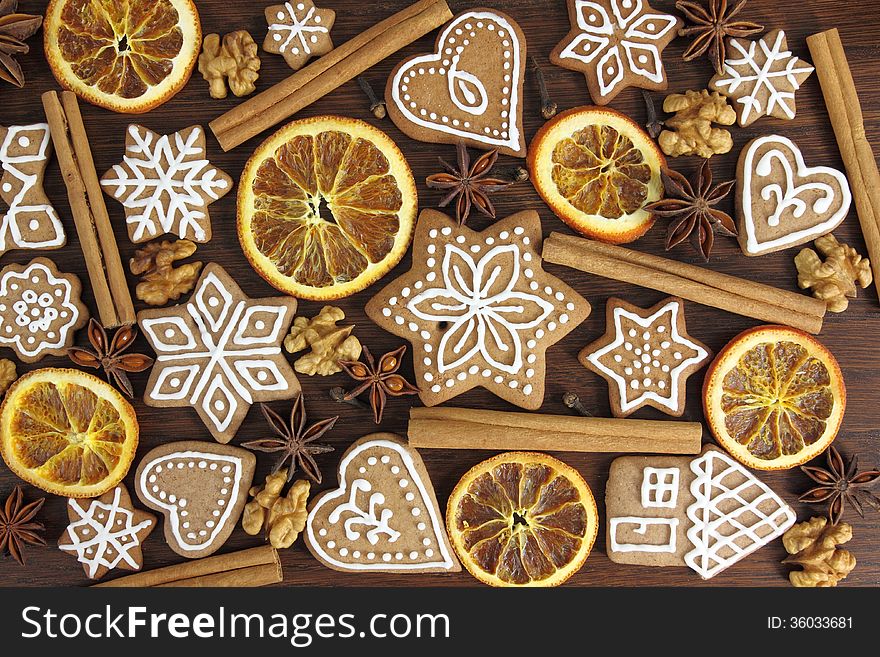 Gingerbread cookies on wooden background. Christmas decoration.