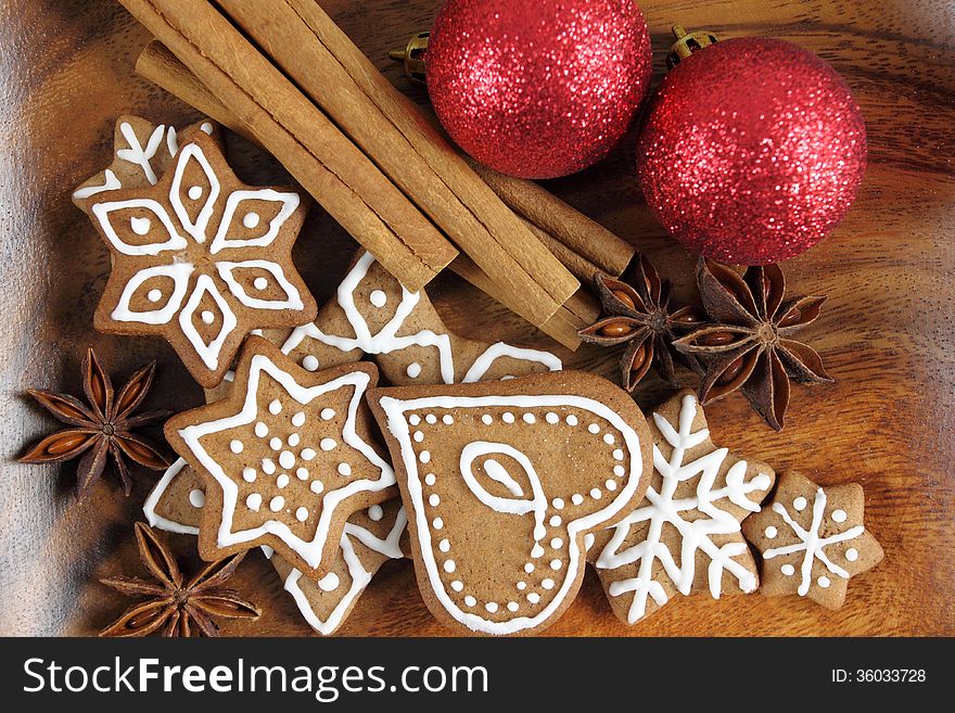 Gingerbread cookies on wooden background. Christmas decoration.