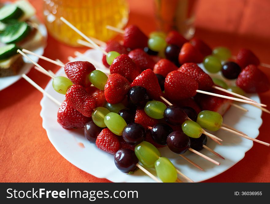 Strawberries and grapes on a stick. Strawberries and grapes on a stick