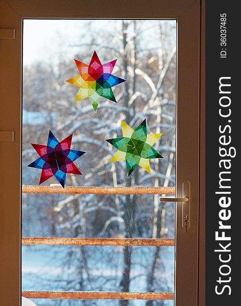 Window decorated with paper stars. Window decorated with paper stars