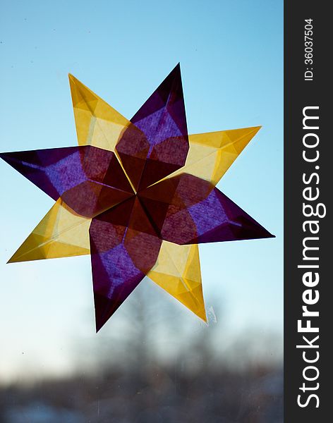 Window decorated with paper star. Window decorated with paper star
