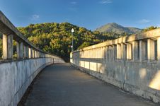 Concrete Bridge With Light Poles Over River Royalty Free Stock Photo