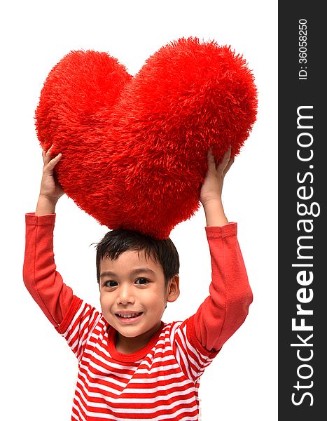 Little boy hold pillow red heart on white background