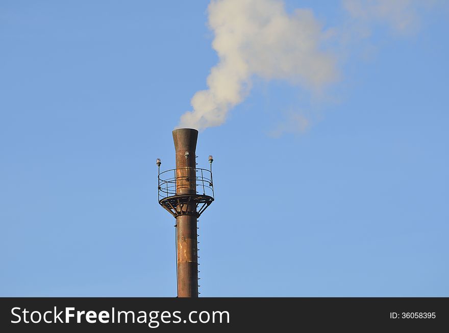 Old pipe unprofitable enterprise in winter day