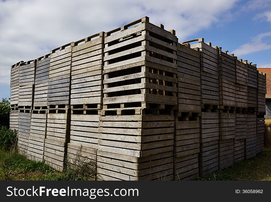 Old wooden pallets for cargo and logistic in a farm yard