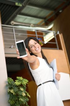 Casual Businesswoman Showing Cellphone Stock Photo Casual Businesswoman Showing Cellphone Stock Photo