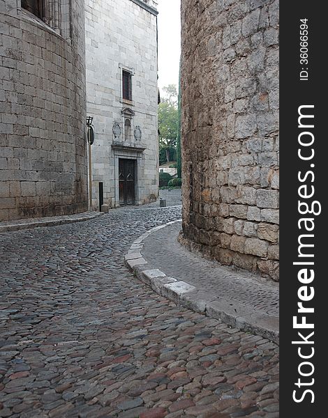 Narrow cobblestone alley in European medieval town