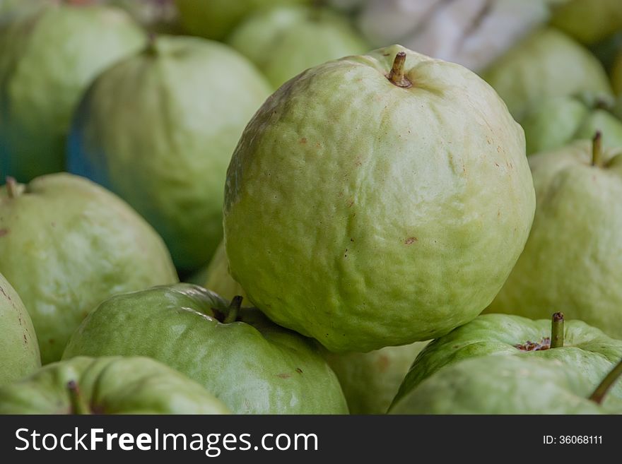 Green apple guava fruits for sale in the market.