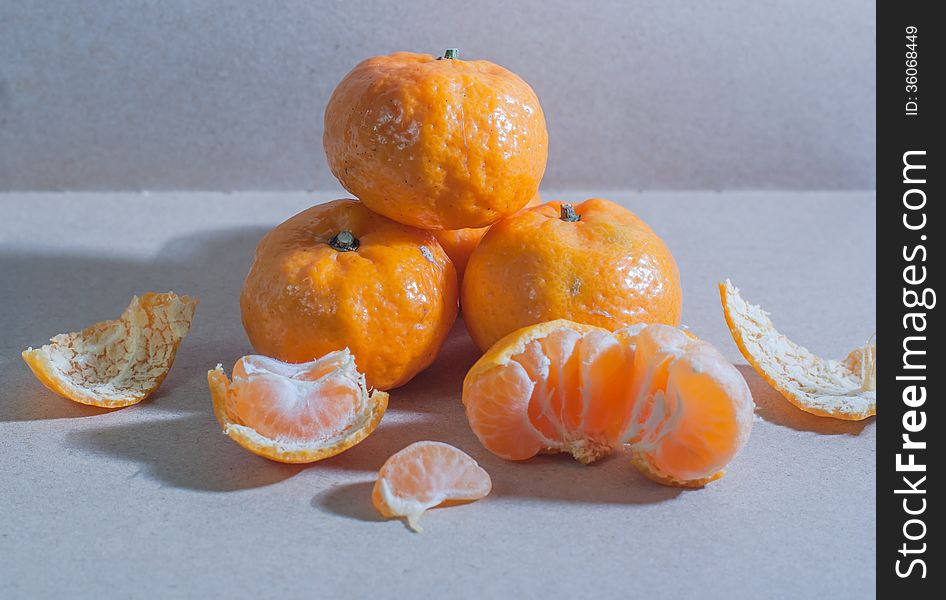 Fresh oranges against dark background.